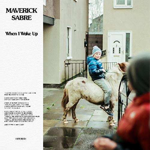 "Vinyl album cover with a child riding a pony outside a house."