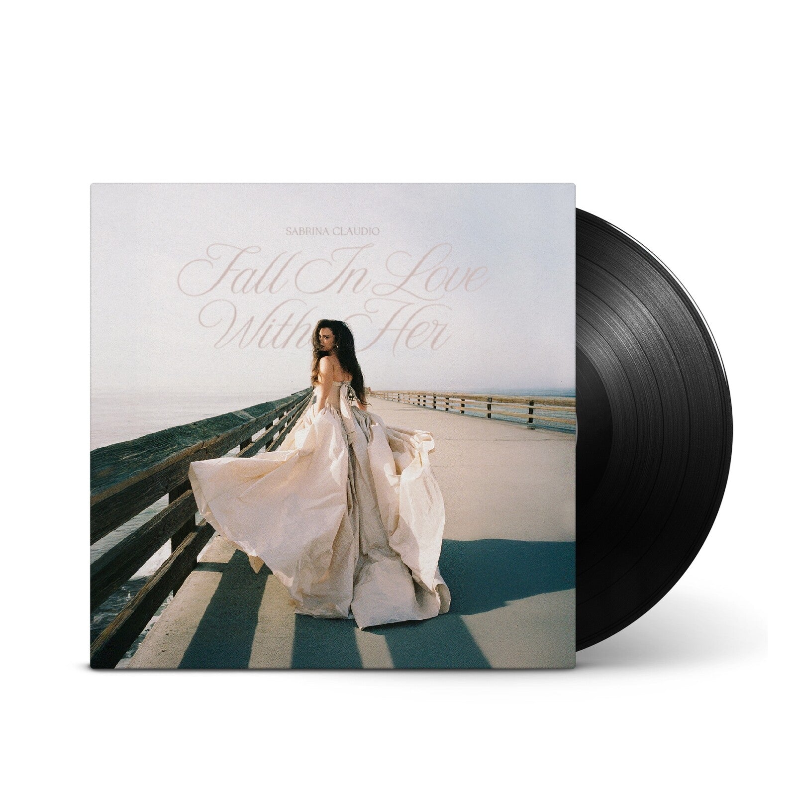 Vinyl record with cover art of a woman in a white dress by the sea.