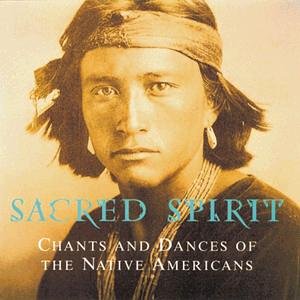 Sepia-toned portrait of a Native American man wearing a headband and beaded necklace.