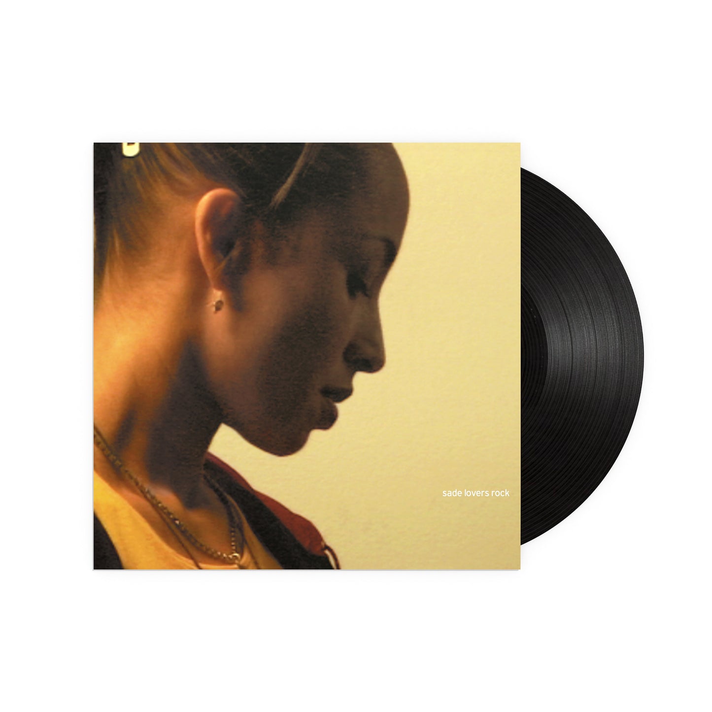 Vinyl record sleeve featuring a side profile of Sade next to a black disc.