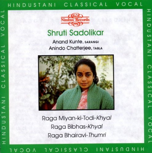 CD cover with a photo of a woman and green border.