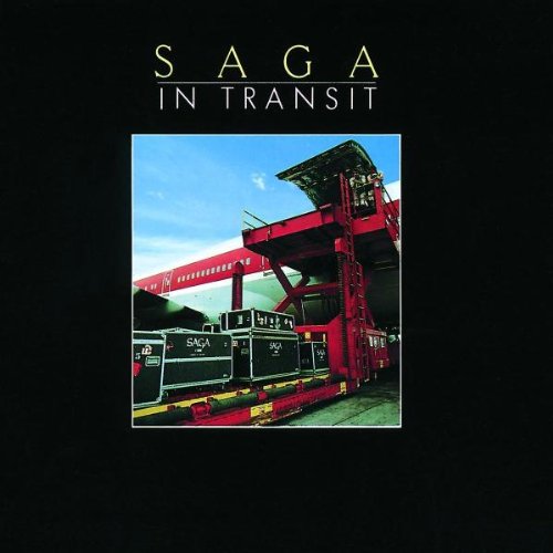 Photo of a red train loader with black cases labeled Saga on a platform.