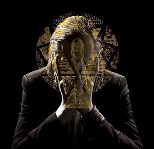 Dark album cover featuring a person with a distorted, layered portrait.