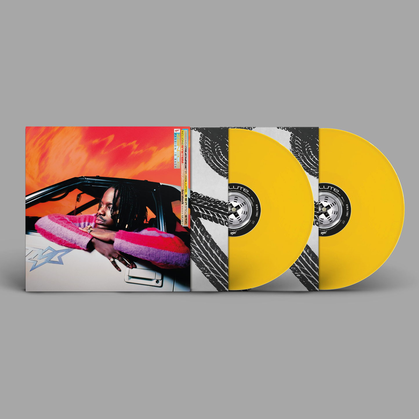 Yellow vinyl record set with cover art featuring a portrait of a man.
