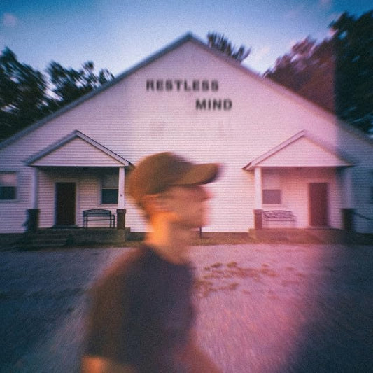Blurred album cover for Sam Barber's "Restless Mind" featuring a church.