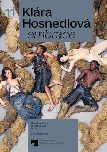 Book cover featuring models posed amongst textured, golden straw-like forms.