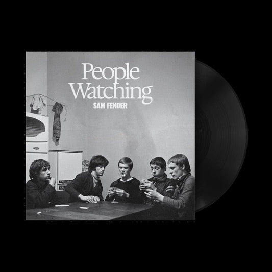 A vinyl record of Sam Fender's album 'People Watching' with a black and white cover featuring the artist and a group of people sitting around a table.