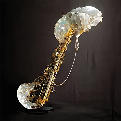Gold saxophone encased in translucent plastic, against a dark background.