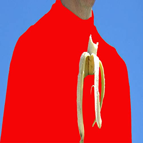 Red-clad figure holds a partially peeled banana against a blue sky.
