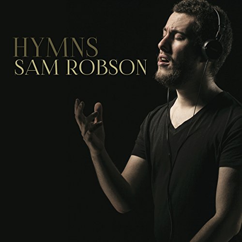 Sam Robson album cover: man with headphones, singing, dark background.
