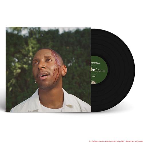 Samm Henshaw album cover featuring a man with red glitter on his face, beside vinyl.