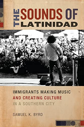 Book cover depicting a guitarist performing before a large outdoor crowd.