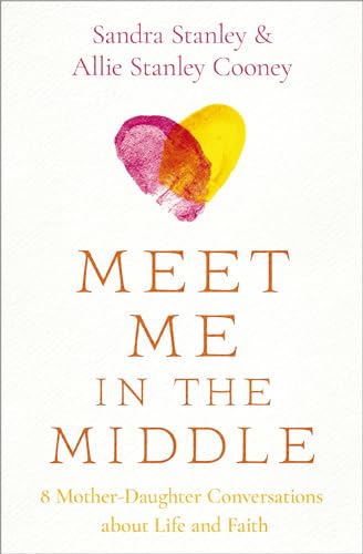 Book cover with painted heart and title "Meet Me in the Middle".