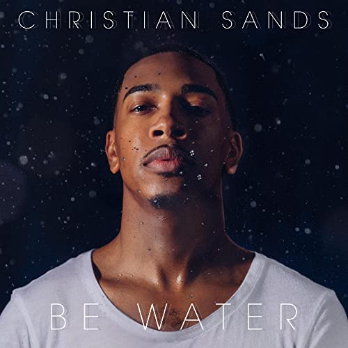 Close-up portrait of Christian Sands with “Be Water” text overlay.