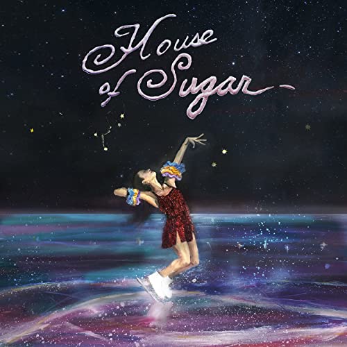 Album cover: figure skater on ice under starry night sky.