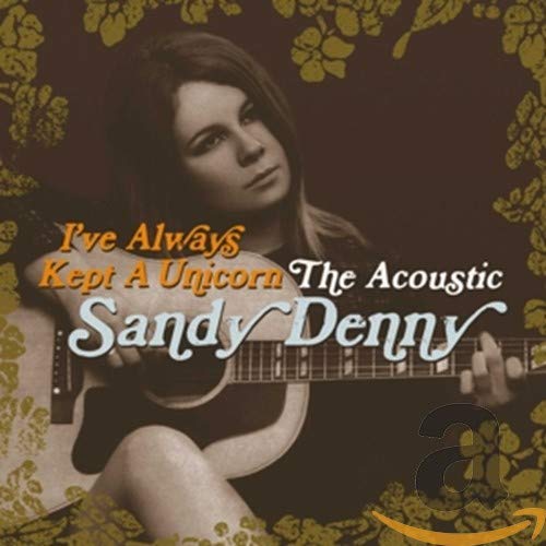 Sandy Denny playing an acoustic guitar on a dark background with gold floral borders.