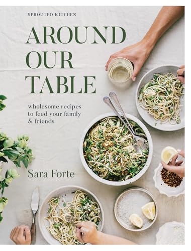 Cookbook cover with food, hands, and title “Around Our Table” visible.