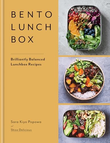 Cookbook cover displaying three colorful bento lunchbox arrangements.