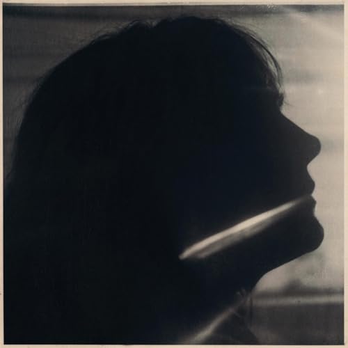 CD cover: Silhouette of a woman’s face in grayscale.
