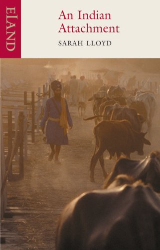 Book cover showing a man in a turban walking alongside cattle in dusty light.
