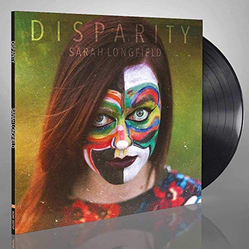 Vinyl record with album cover featuring a woman with painted face.