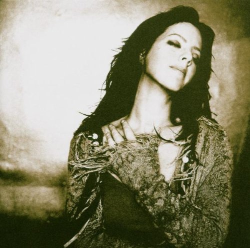 Sarah McLachlan portrait, sepia toned, eyes closed, long dark hair.
