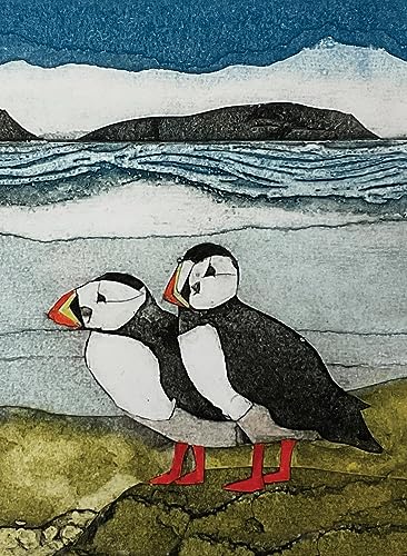 Two puffins with colorful beaks stand before a coastal landscape.