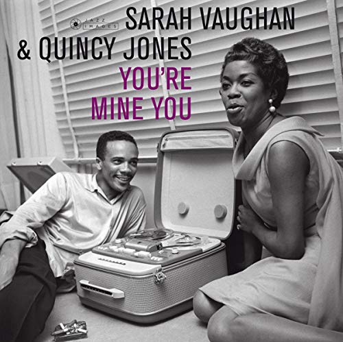 Black and white album cover with man and woman beside an open suitcase.