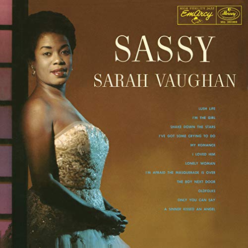 Sarah Vaughan's "Sassy" vinyl album cover, portrait of a woman in a gown.