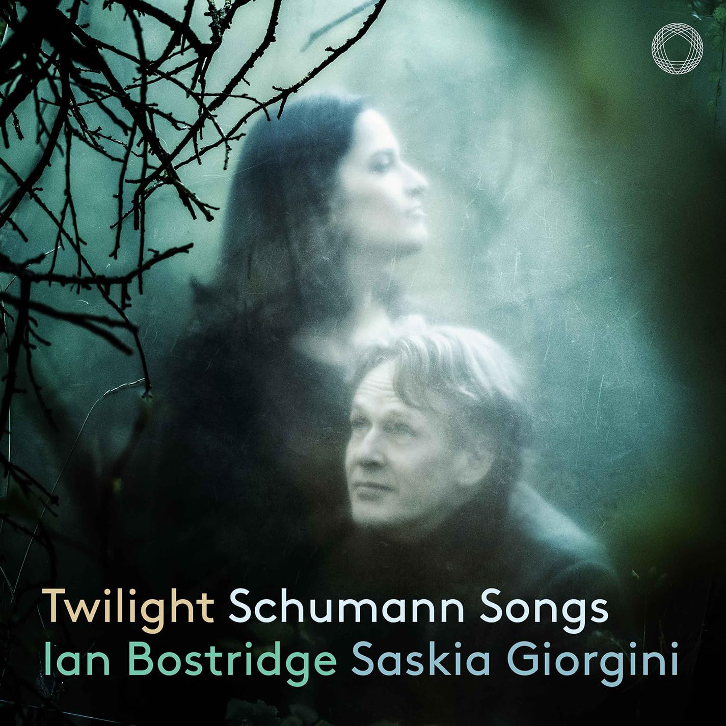 CD cover with portraits of two musicians against a dark, branch-filled background.