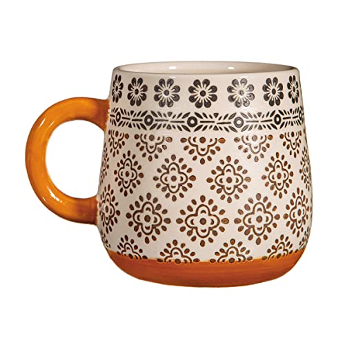 Cream mug with brown and grey floral pattern and orange handle.
