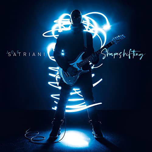 Joe Satriani album cover: guitarist with glowing blue light swirls.