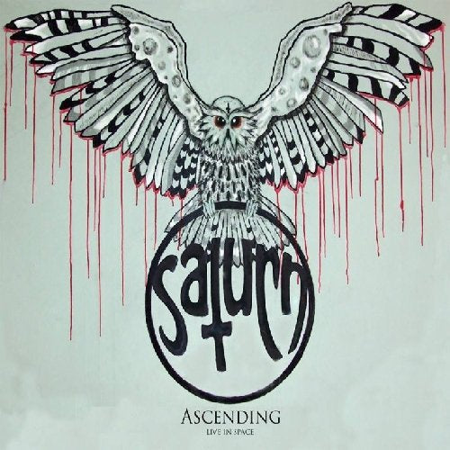 Vinyl record cover: owl with large wings, Saturn text, red drips.