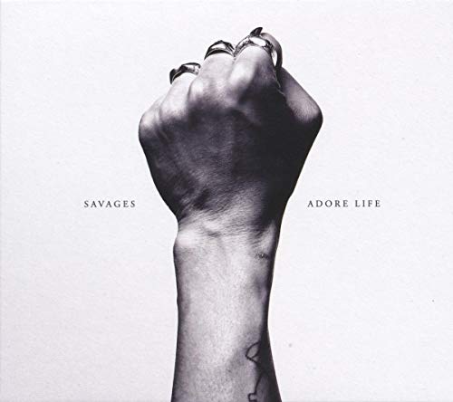 Black and white album cover featuring a raised fist with rings.
