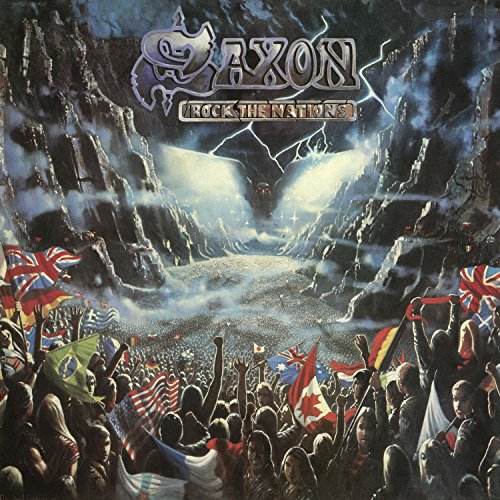 "Saxon album cover art featuring a crowd waving flags, with a rocky, misty landscape."