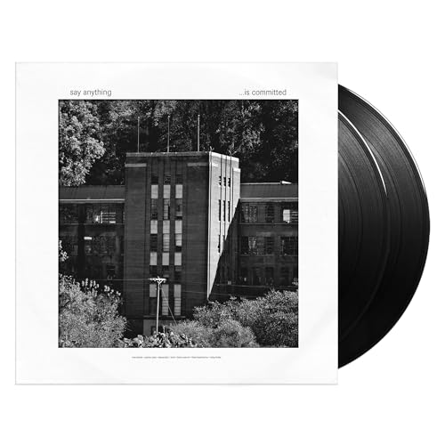 Vinyl record cover featuring a black and white building with two black vinyl discs.
