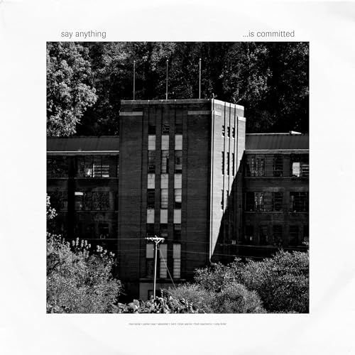 Black and white album cover featuring a large brick building surrounded by trees.