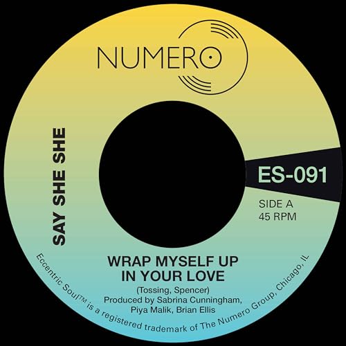 Vinyl record label with yellow-green gradient, black center, and text.