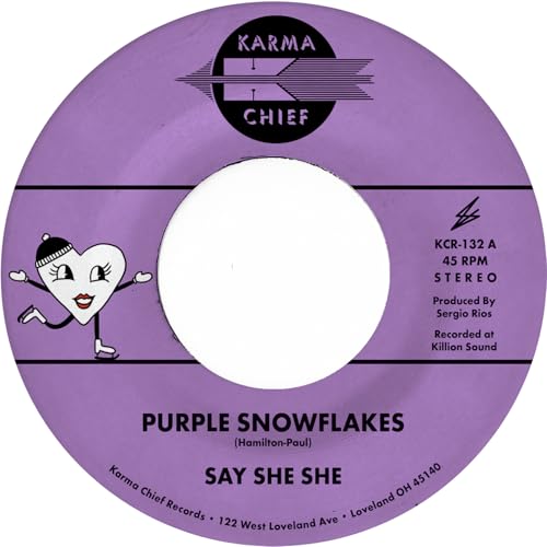 Purple vinyl record label for Say She She featuring a cartoon heart on skates.