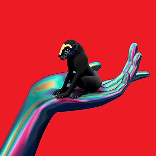 A black creature with a patterned face sits on an iridescent hand against red.
