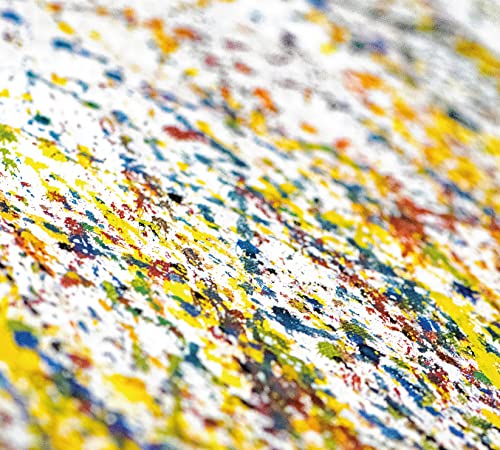 Close-up of a CD with a colorful, speckled paint-splatter design.
