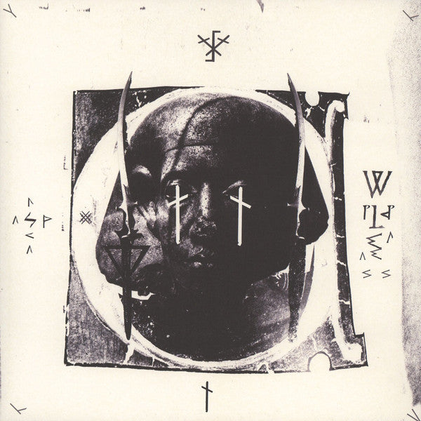 Dark, abstract portrait with crosses and geometric shapes on a vinyl record cover.