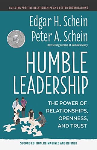 Book cover for "Humble Leadership" by Schein, featuring people and puzzle pieces.