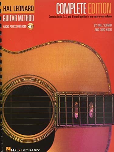 Spiral-bound guitar method book with acoustic guitar image on cover.