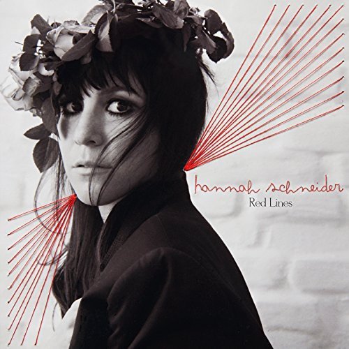 Black and white album cover featuring a woman wearing a floral headpiece with red lines.