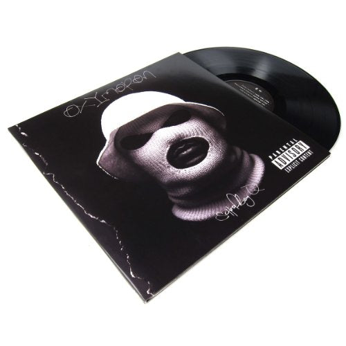 Schoolboy Q’s “Oxymoron” vinyl record with a masked face cover.