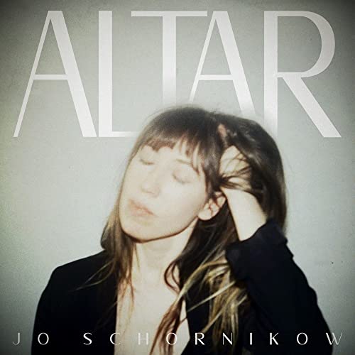Album cover featuring Jo Schornikow with eyes closed and hand in hair, titled Altar.