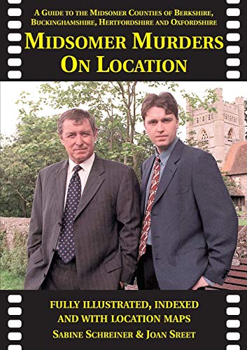 Book cover showing two men in suits with a church and trees in background.