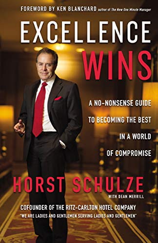 Book cover featuring a man in a suit, titled "Excellence Wins.