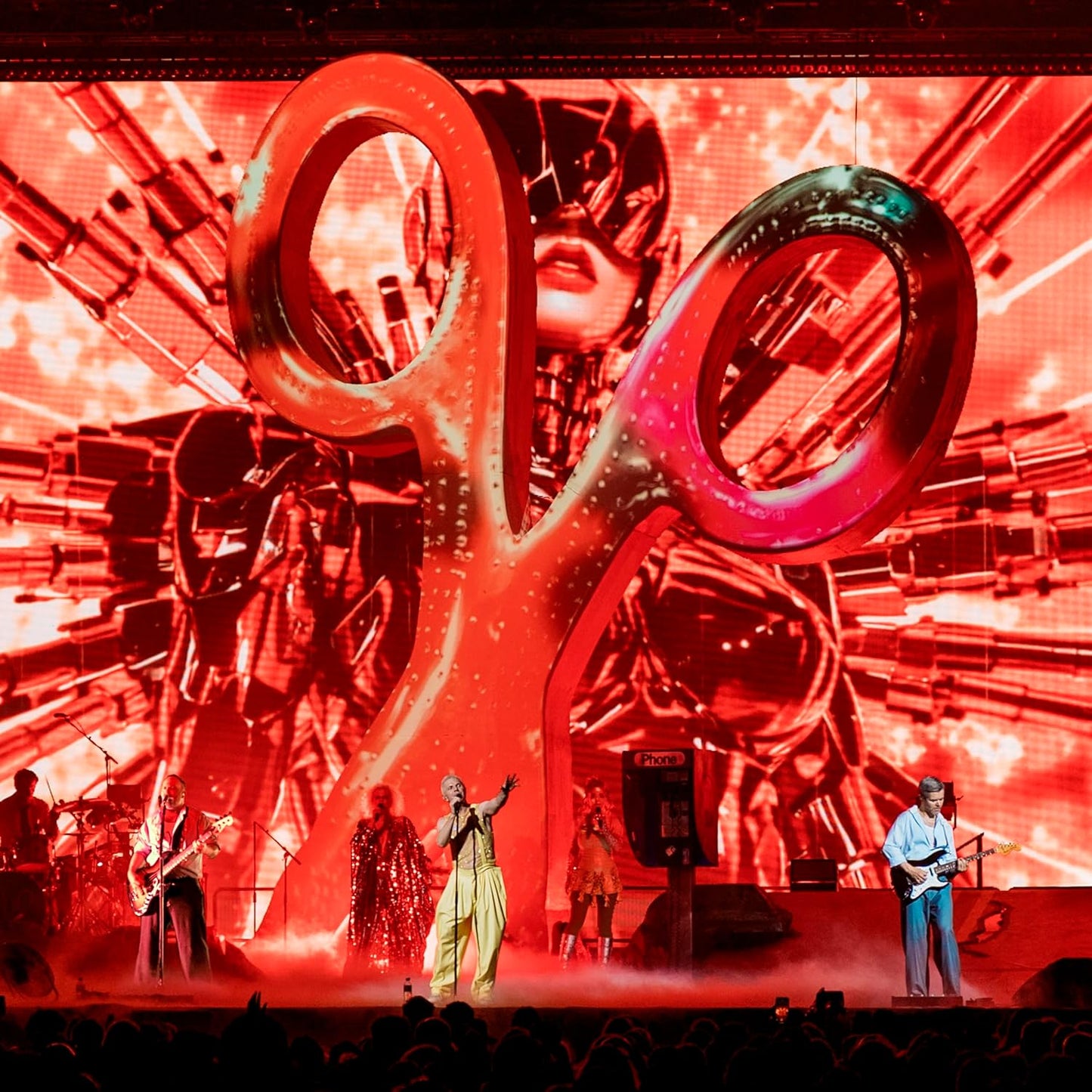 Scissor Sisters album cover featuring large scissors and performing band.